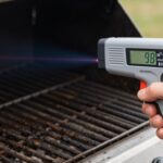 ThermoWorks Industrial IR Gun being used to measure grill temperature